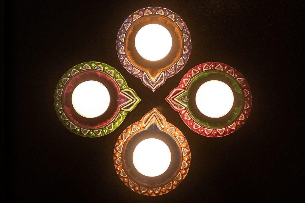 Rows of lit clay diyas for Deepavali traditions in Telugu homes