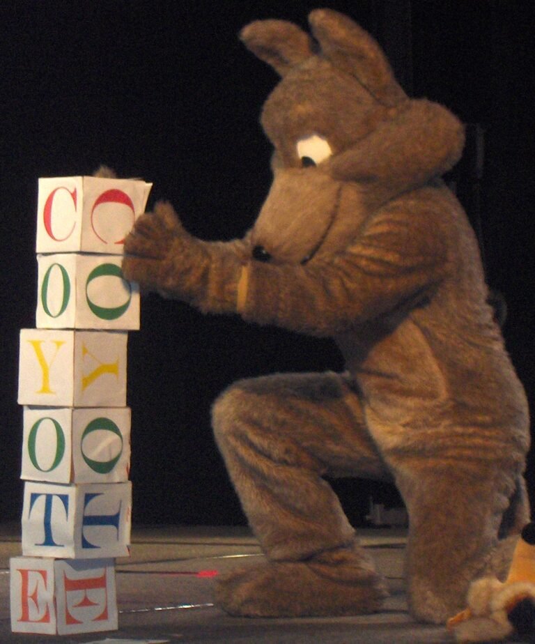 Toddler playing with colourful stacking blocks, one of many educational activities for toddlers