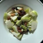 Bowl of fresh fruit and nuts, examples of healthy snacks for kids