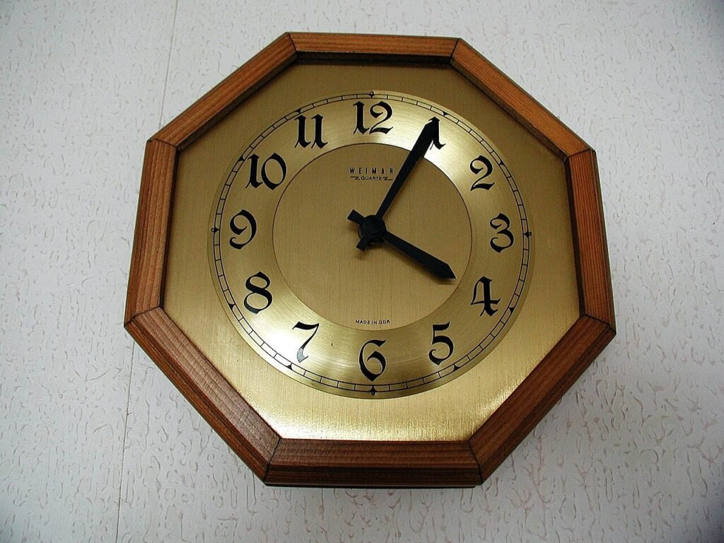Colourful analogue clock for learning how to teach kids to tell time