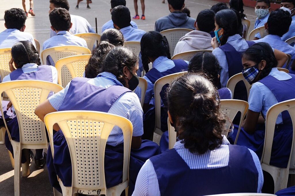 Children walking together into a school building, from a story about making friends for kids