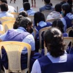 Children walking together into a school building, from a story about making friends for kids