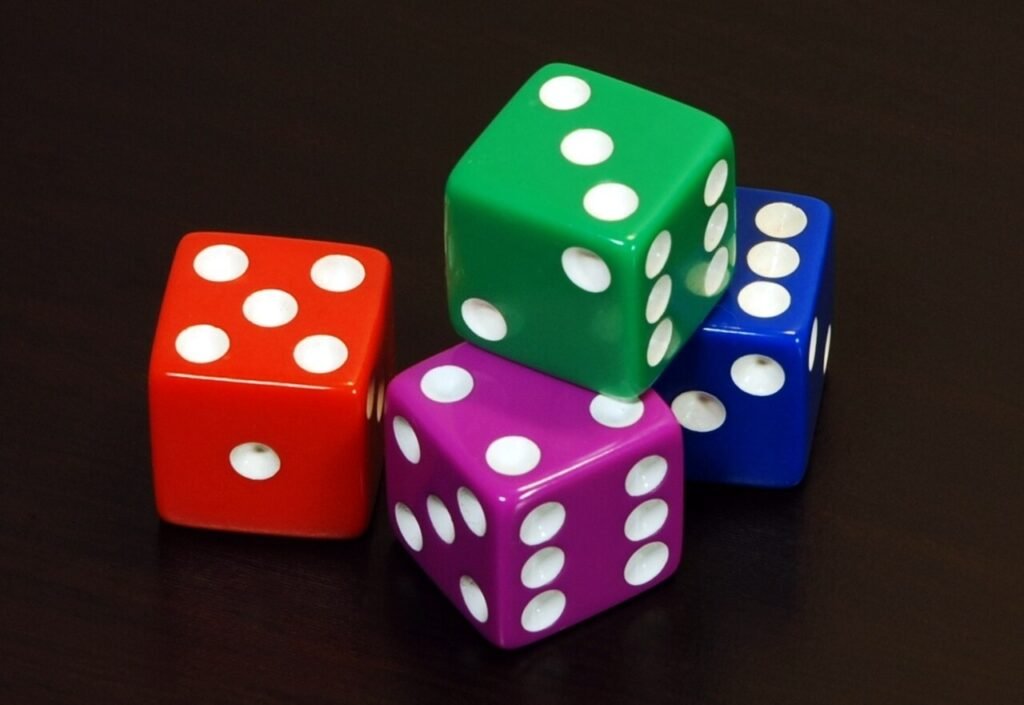 Children playing a board game with dice, one of many math games for kids
