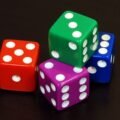 Children playing a board game with dice, one of many math games for kids