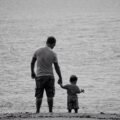 Parent calmly talking with a child, demonstrating positive discipline techniques