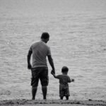 Parent calmly talking with a child, demonstrating positive discipline techniques