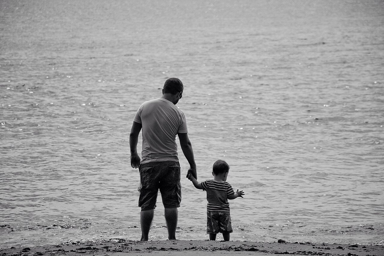 Parent calmly talking with a child, demonstrating positive discipline techniques