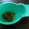 Toddler with a small potty seat, illustrating potty training tips