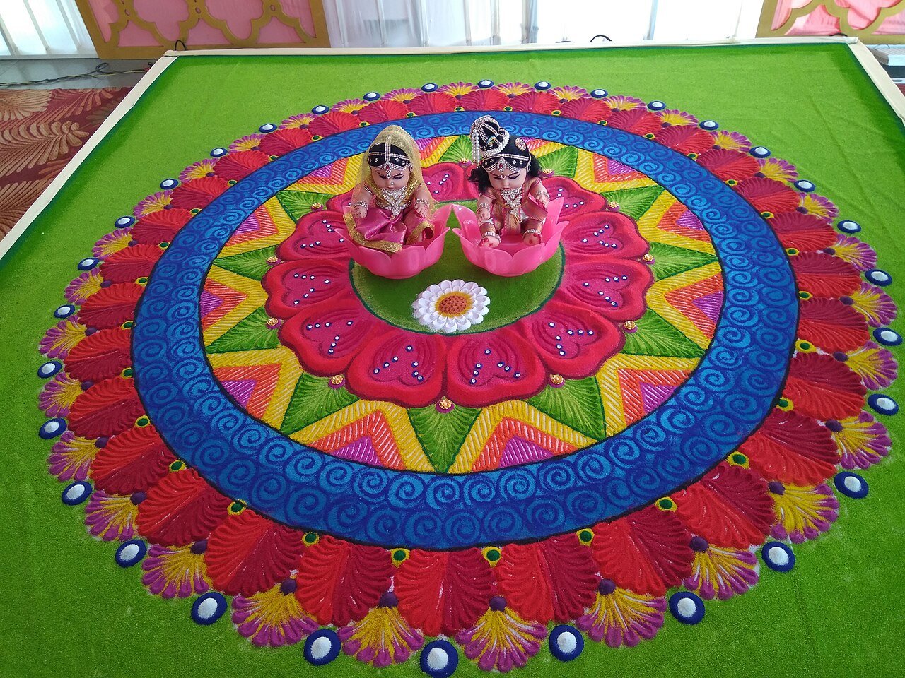 Colourful rangoli muggulu design drawn for Sankranti festival traditions