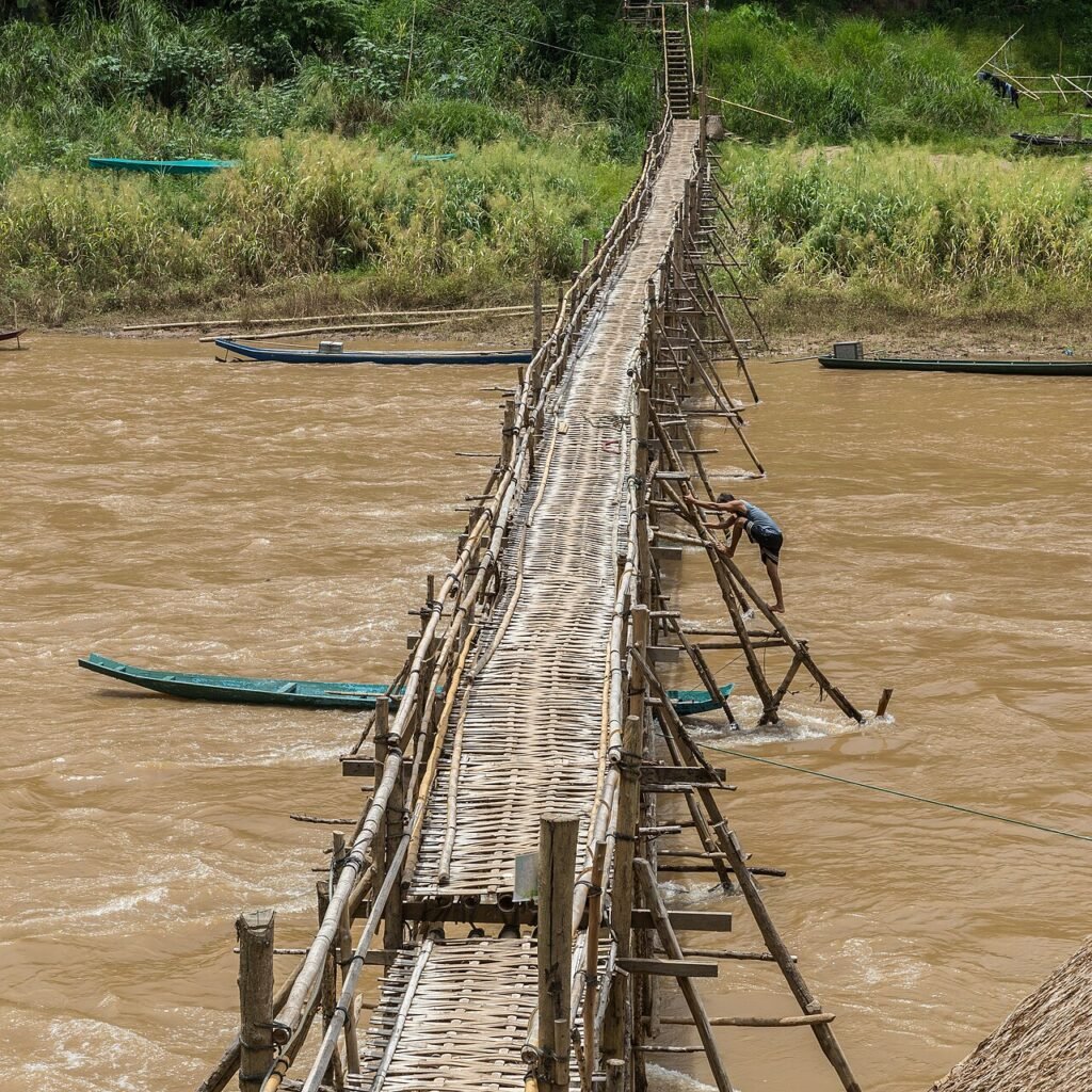Bamboo footbridge across a river, from a short story about friendship and forgiveness