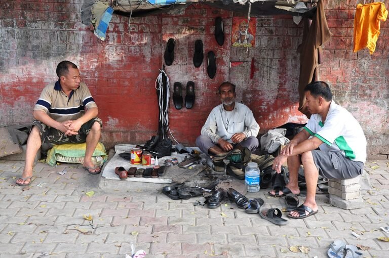 Traditional cobbler repairing shoes on a street, from a short story about contentment for kids