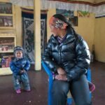 Parent talking face to face with a toddler, supporting toddler speech development milestones
