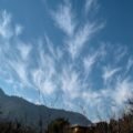 Bright blue sky with white clouds, answering why is the sky blue for kids